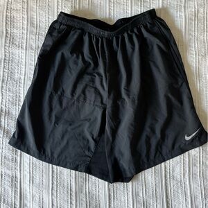 Nike Black Athletic Shorts with Silver Swoosh Accent